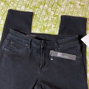 Brand new designer jeans. Size 2. Black with rips/distressing at knees.